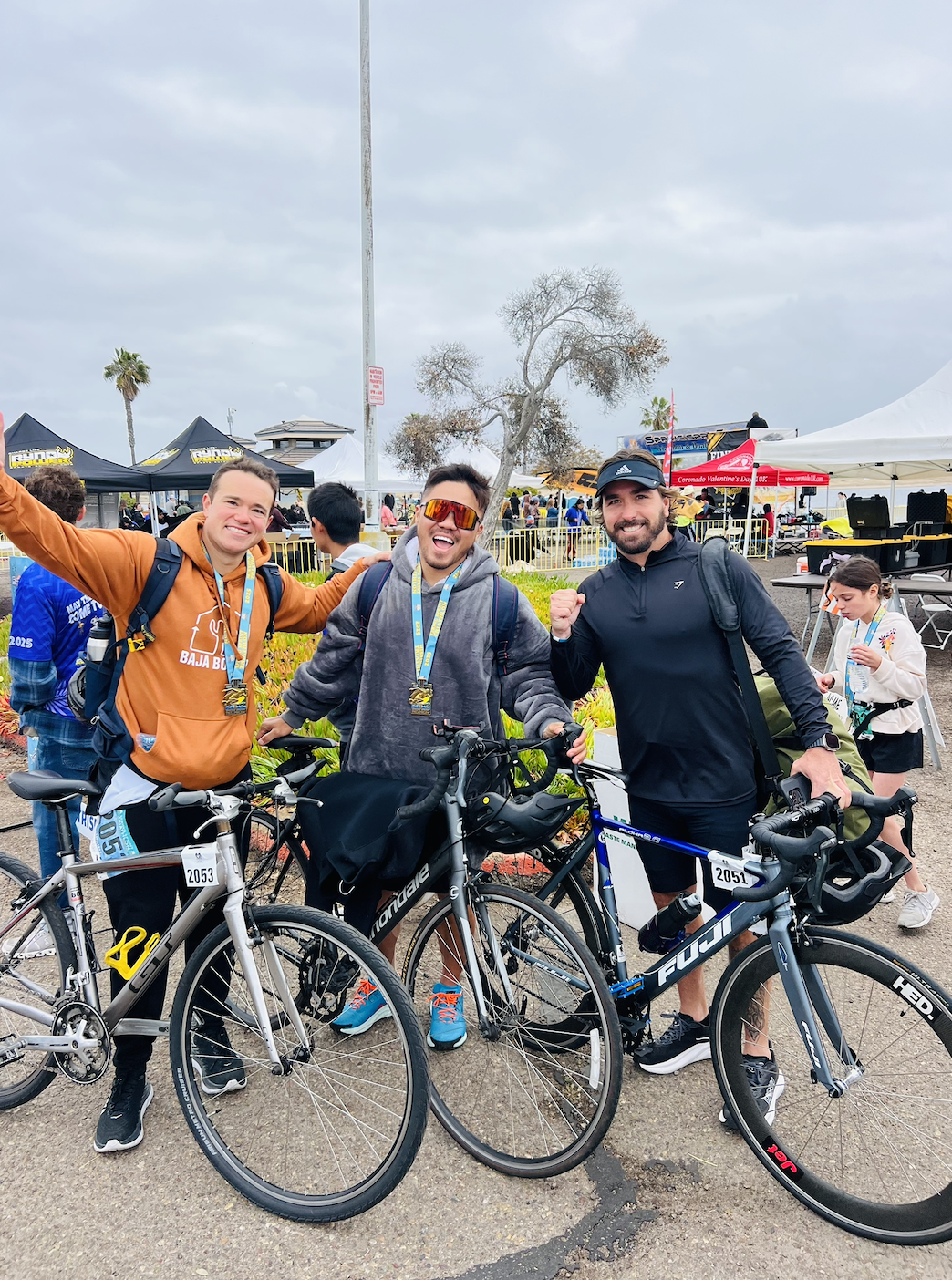 Nelson with friends and their bikes after finishing a triathlon