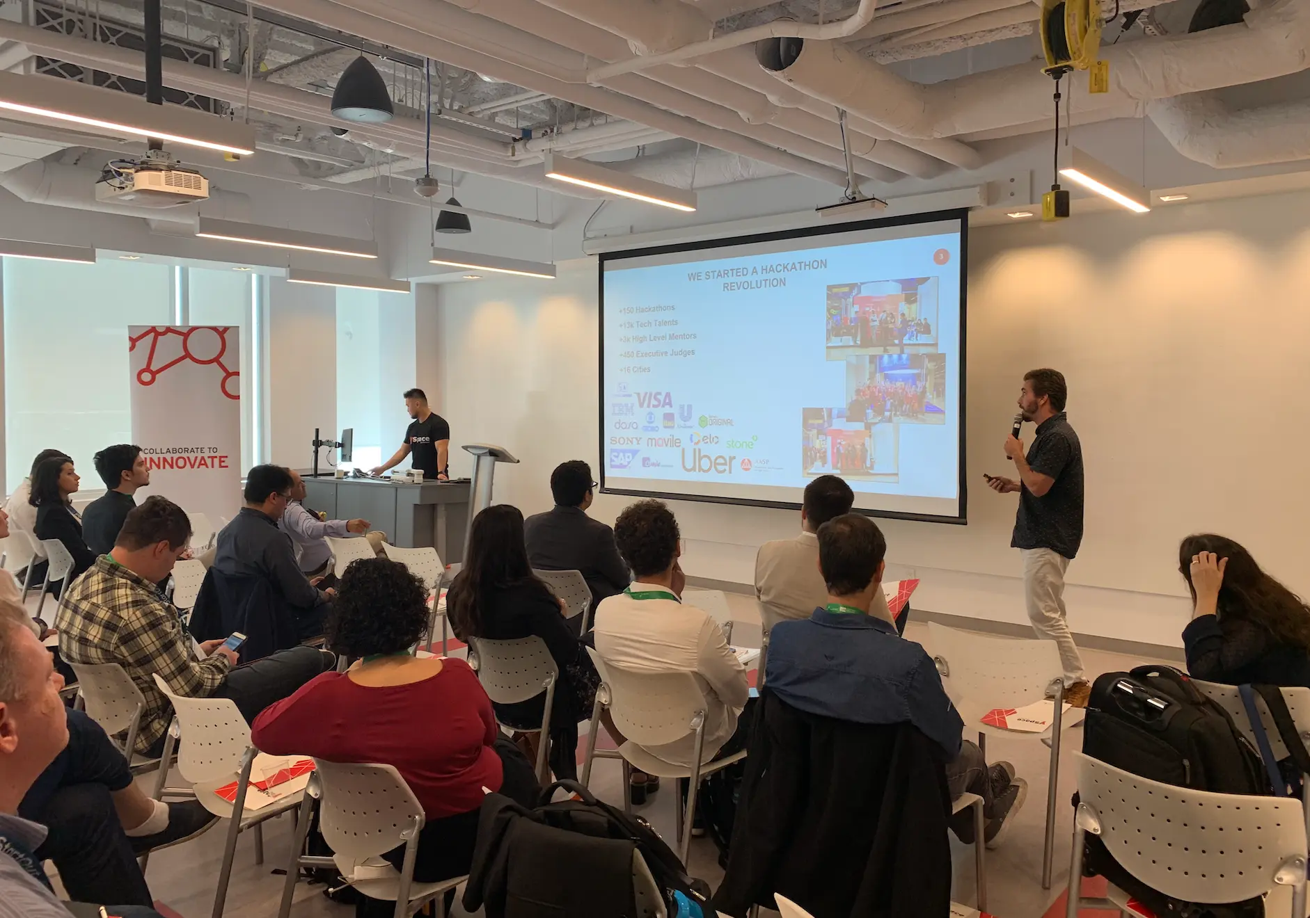Presenting the hackathon program to an audience in an office