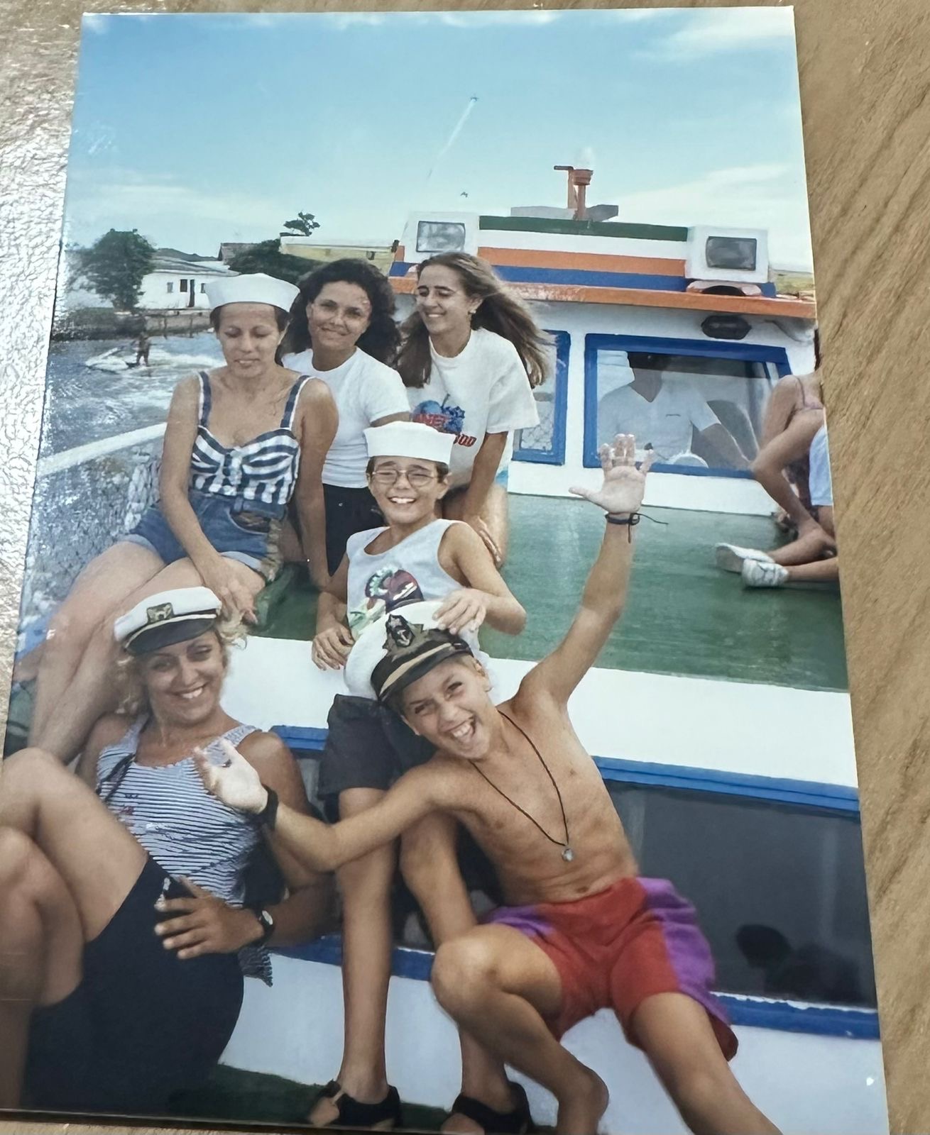 Nelson as a kid with family on a boat in Brazil, everyone in sailor hats